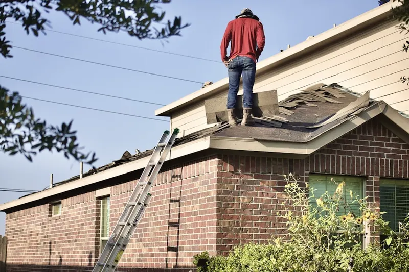 Professional roofer working on a residential roof in Searingtown
